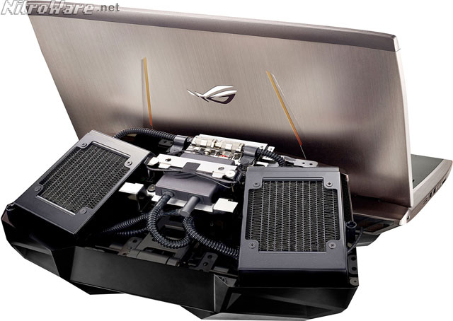 Opening the GX700's dock reveals the internals of its liquid cooling system, being its twin radiators, hot/cold pipework, pump, electrical connections to feed the laptop and finally the quick-release mechanism to pass the cooling liquid through to the laptop itself asus rog gx700 dock internal liquid cooler
