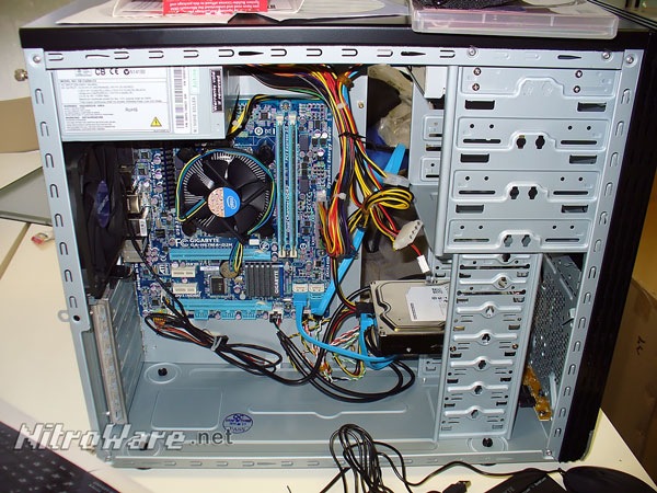 Completed 2011 system with Intel Core i5-2300 CPU and Gigabyte Micro ATX motherboard. Note the cutouts for but lack of the tool-less drive locks. The basic cable managment was all that was possible using the provided accessories. gigabyte_gz-x1_case_med