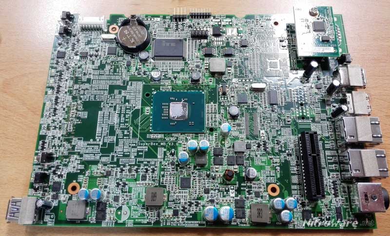 Motherboard from the Seagate NAS Pro device with the Intel Atom C2000 processor middle. Note the lack of other large ICs on the top side of the board, as it is mainly power supply and glue logic. The chip marked ITE is a controller that provides the legacy buses. The small daughterboard top-right is a USB3 Flash drive and the bottom side of the board has USB3, LAN and DDR3 memory. seagate nas pro motherboard intel atom c2000 rangeley